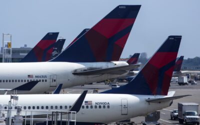 Delta lays off some corporate workers to cut costs