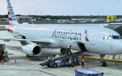 American Airlines raises bag fees, limits miles for travel agency bookings
