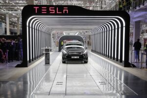 Teslas stock surges after deliveries surprise to the upside by