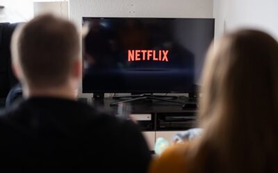 With media in upheaval, Netflix stays out of the fray