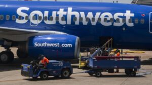 Southwest Airlines will charge for checked bags for first time