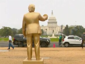 Golden Trump statue with Bitcoin was installed outside Capitol before