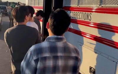 Hyundai, LG workers caught up in immigration raid fly home to South Korea
